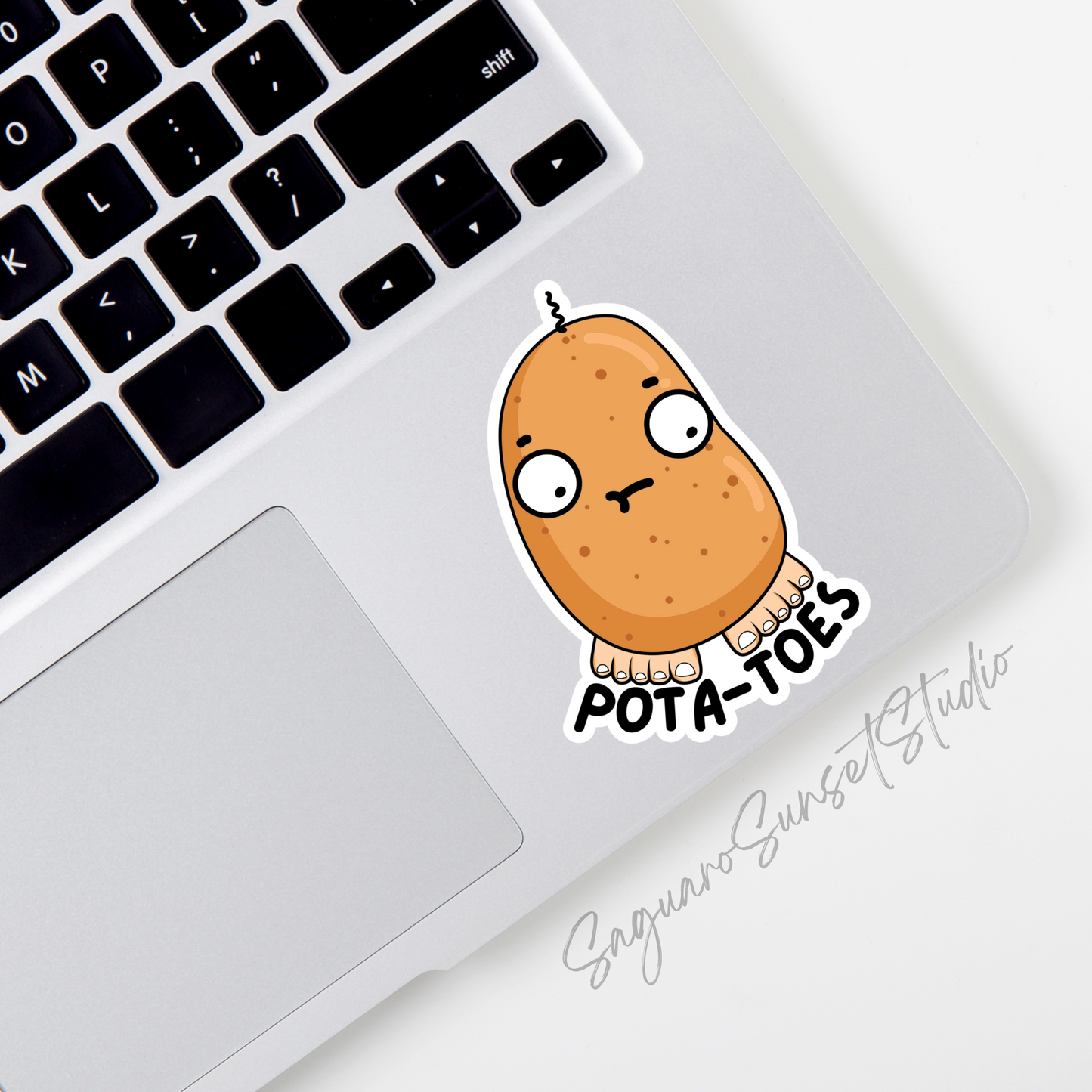 A sticker featuring a cartoon potato with a goofy expression, complete with toes at the bottom, and the text "Pota-Toes" curved below the design.
