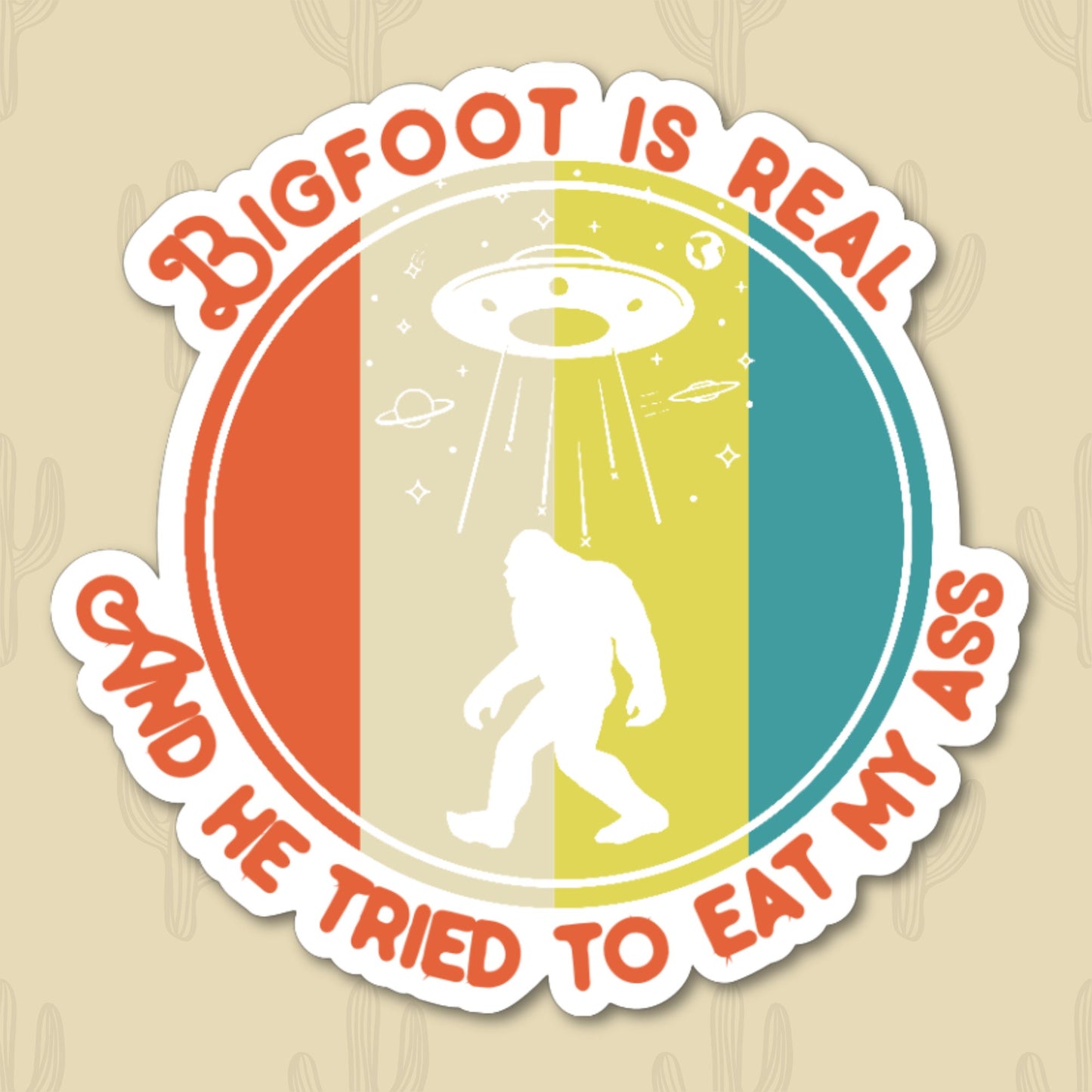 A sticker featuring the phrase "Bigfoot is Real and He Tried to Eat My Ass" written in retro-style orange text. The design includes a silhouette of Bigfoot with a UFO beaming down light in the background, set against a colorful striped backdrop.