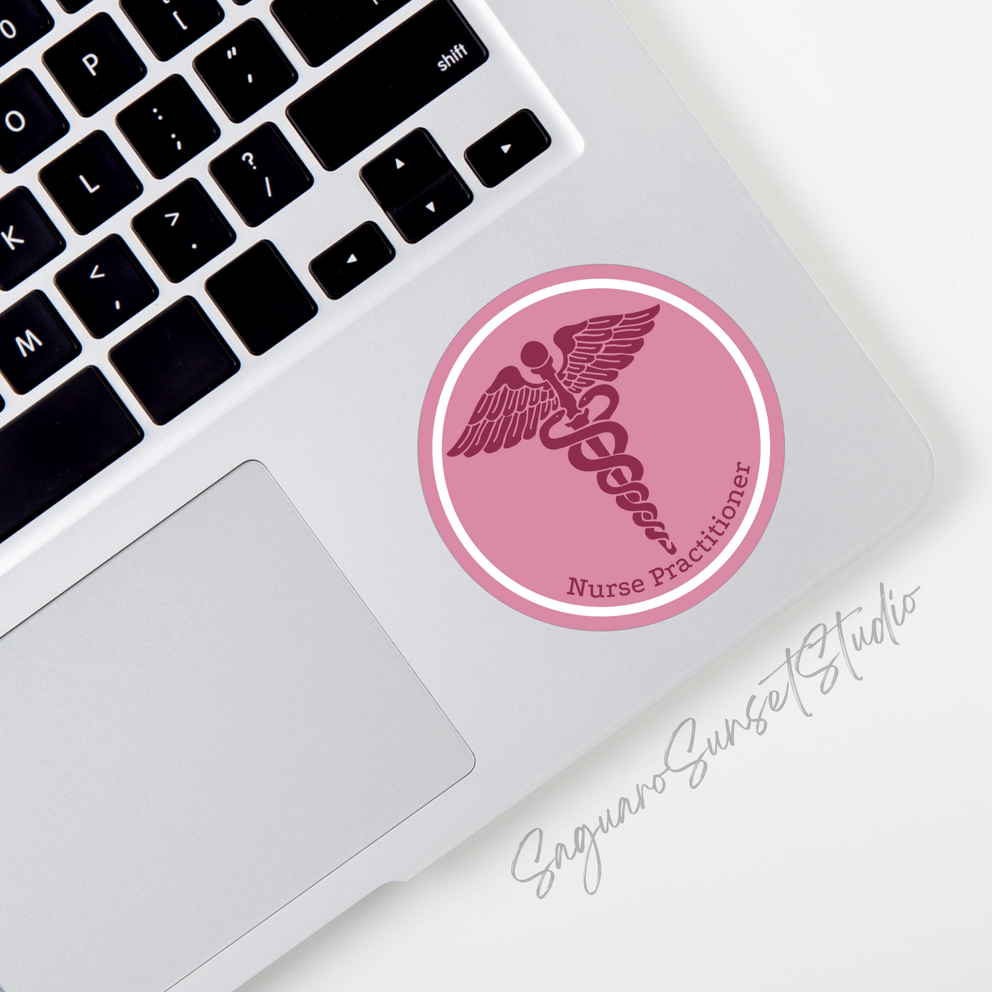 Pink circular sticker featuring the caduceus symbol and the words "Nurse Practitioner," designed to be professional and stylish.