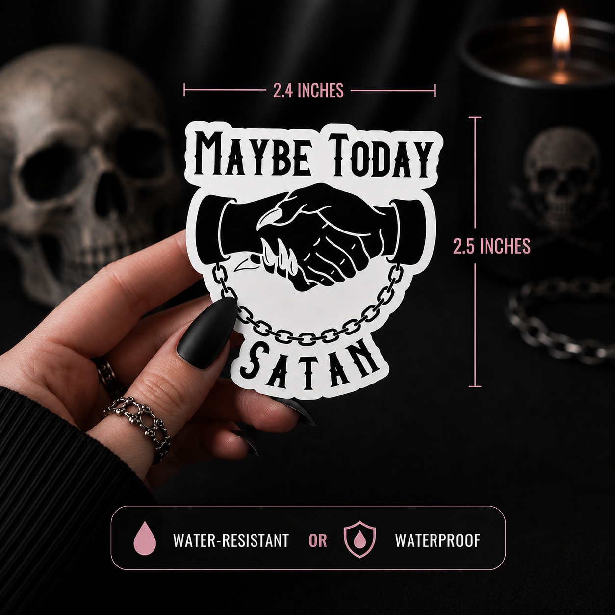 A hand holds a white die-cut sticker featuring a black handshake and the words “MAYBE TODAY SATAN,” with dimension lines showing 2.4 inches wide by 2.5 inches tall