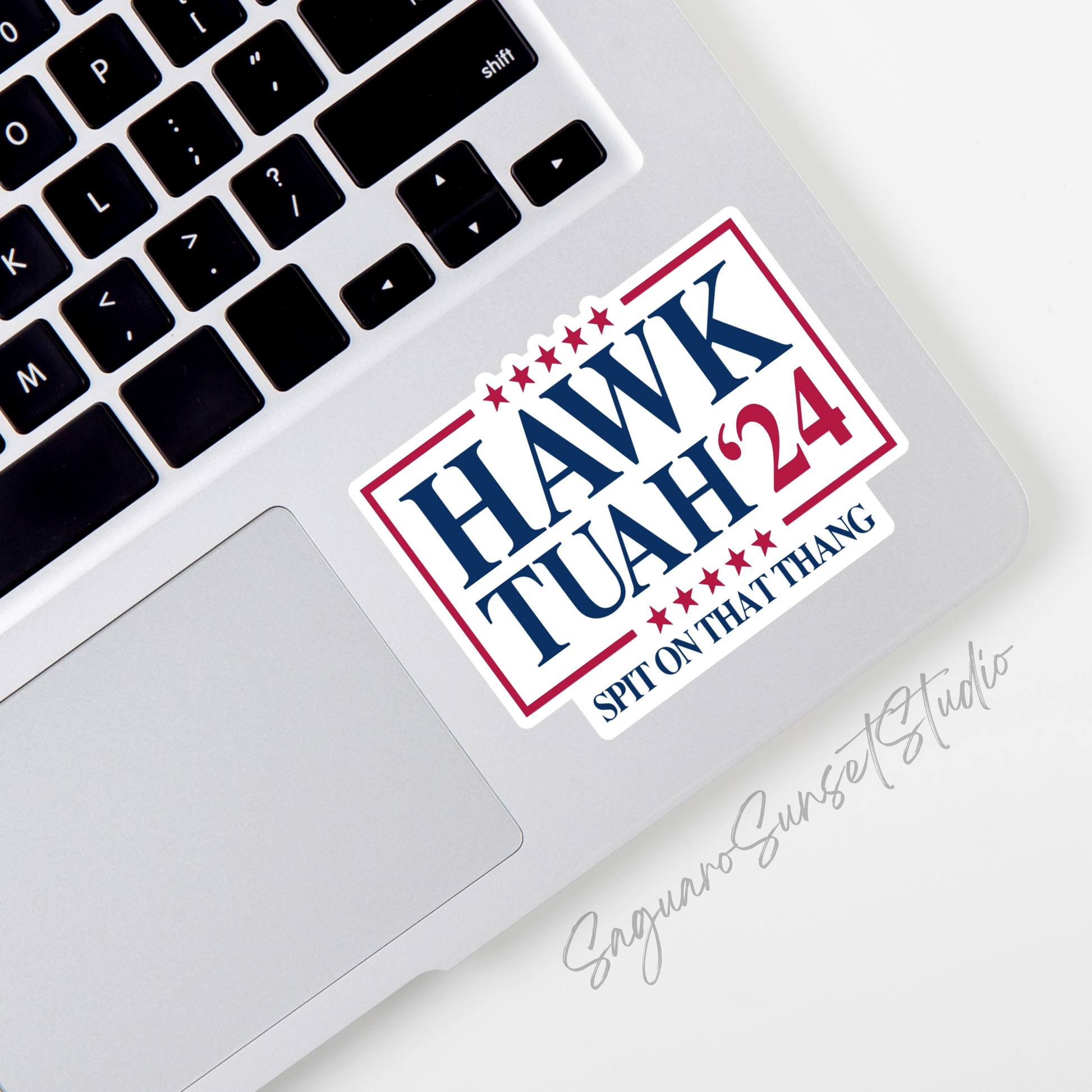 Sticker featuring the text "Hawk Tuah '24" with stars and the slogan "Spit On That Thang" in red, white, and blue colors.