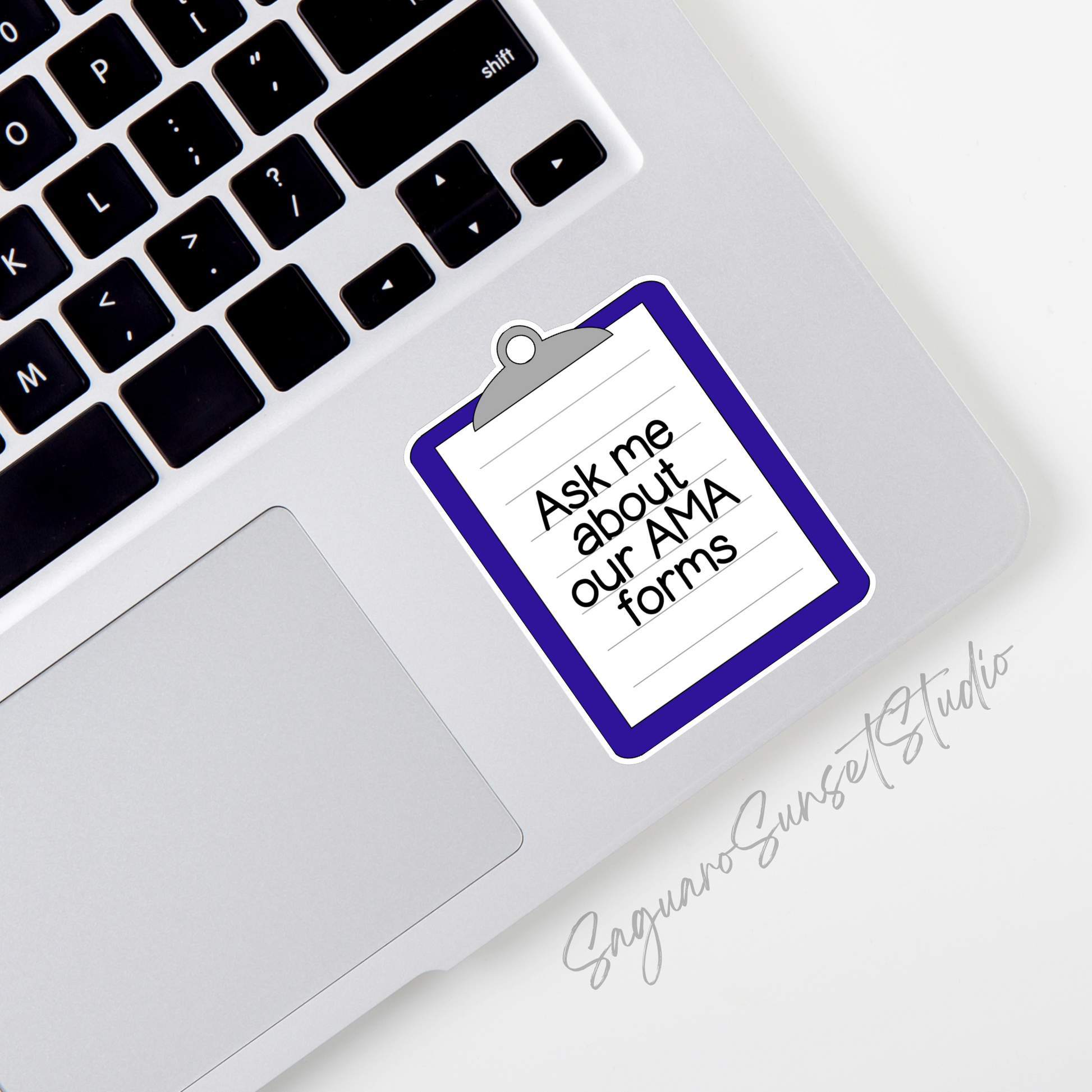 A royal blue clipboard sticker on the corner of a laptop with the text 'ask me about our AMA forms' written on it.