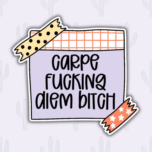 Sticker with the text "Carpe Fucking Diem Bitch" in bold, black handwritten letters on a purple background with a grid pattern and decorative tape illustrations.