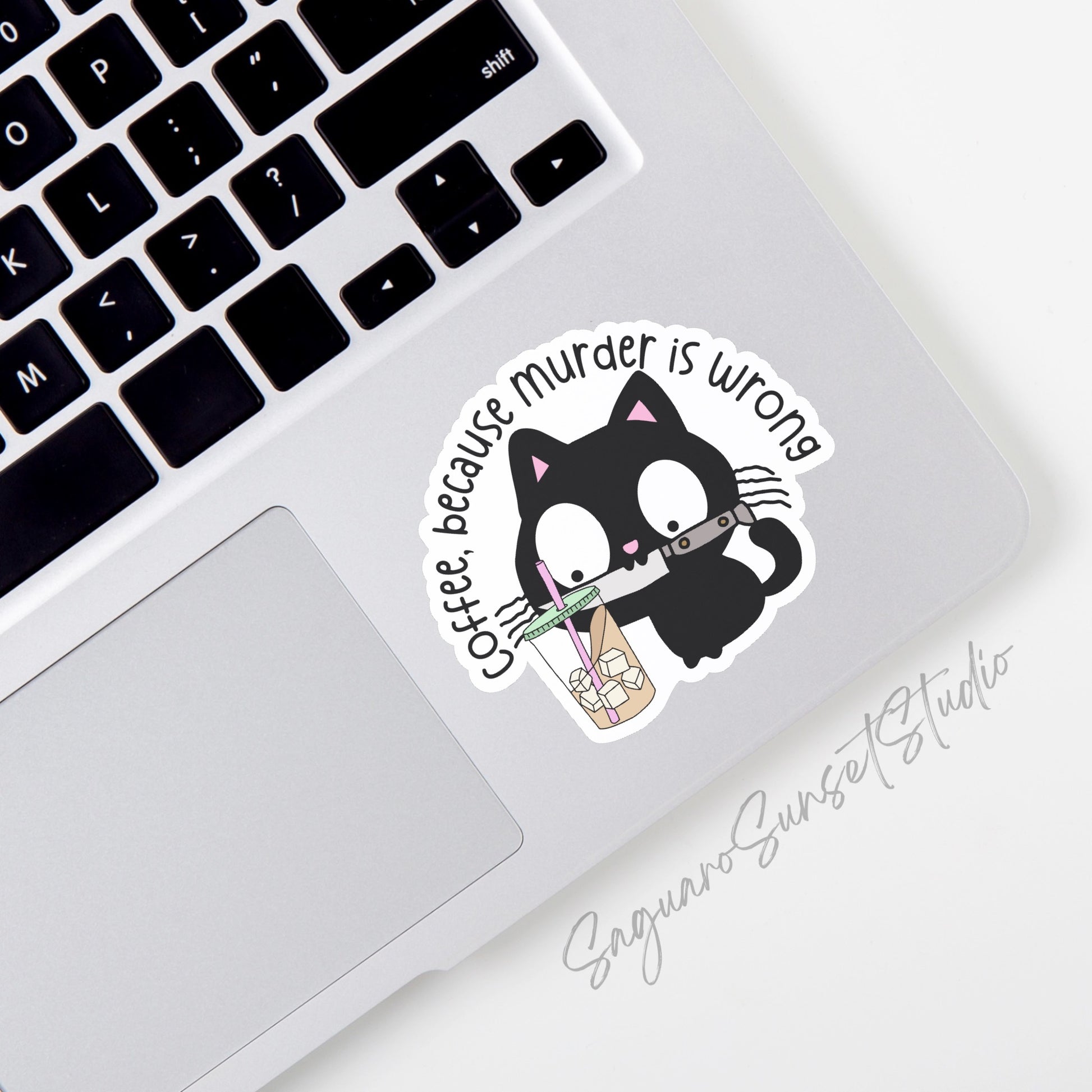 a sticker of a black cat drinking an iced coffee and holding a knife with the phrase 'coffee, because murder is wrong'