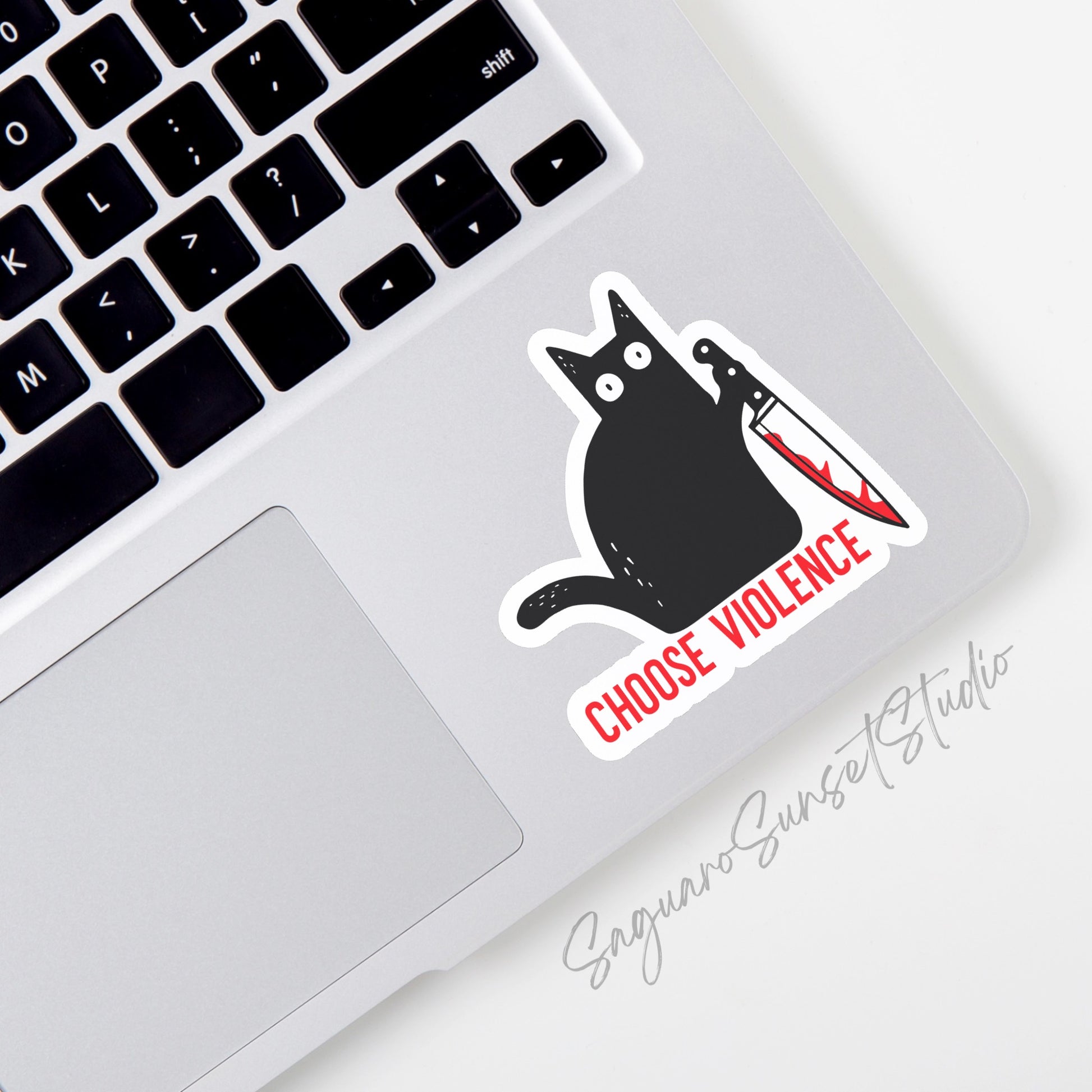 A sticker of a black cat holding a knife with blood with the phrase 'choose violence'