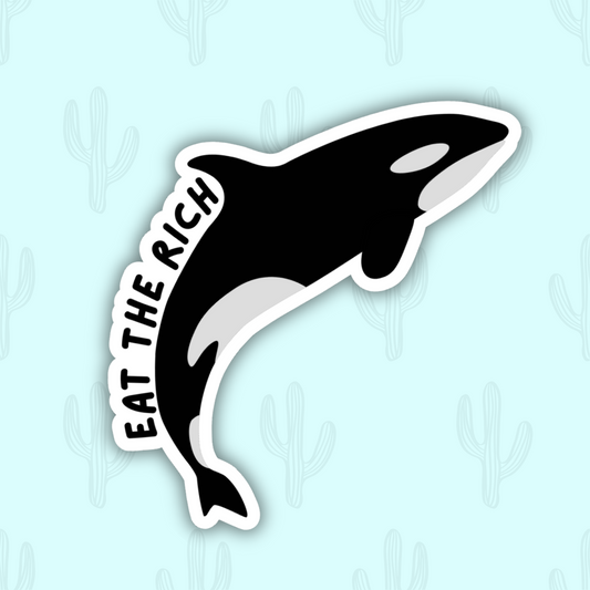 A sticker featuring a black and white orca jumping with the text "Eat the Rich" curving along its body in bold lettering.