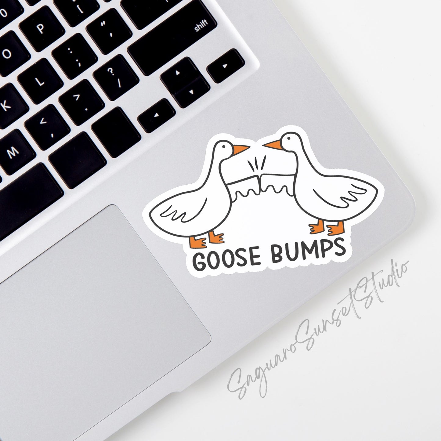 A vinyl sticker featuring a playful illustration of two geese bumping their fists together with the phrase "Goose Bumps" below