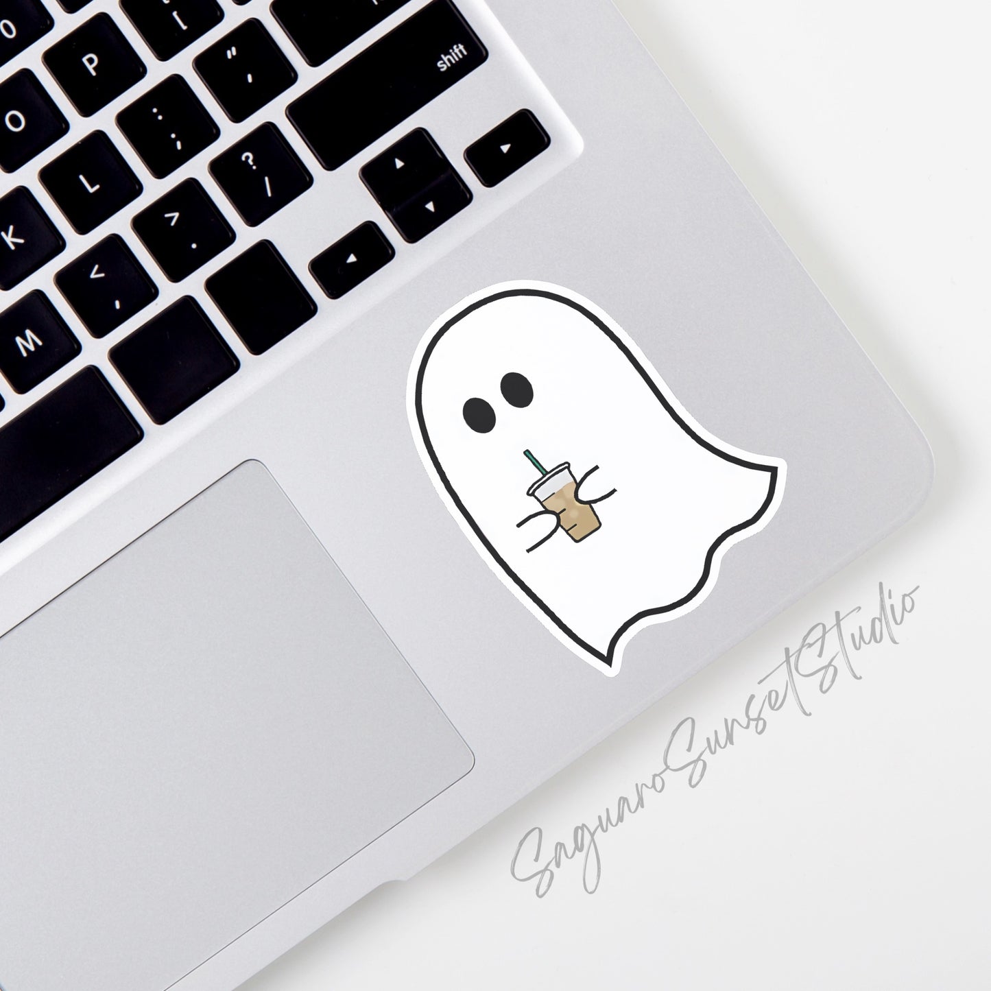 A vinyl sticker featuring a cute ghost holding an iced coffee