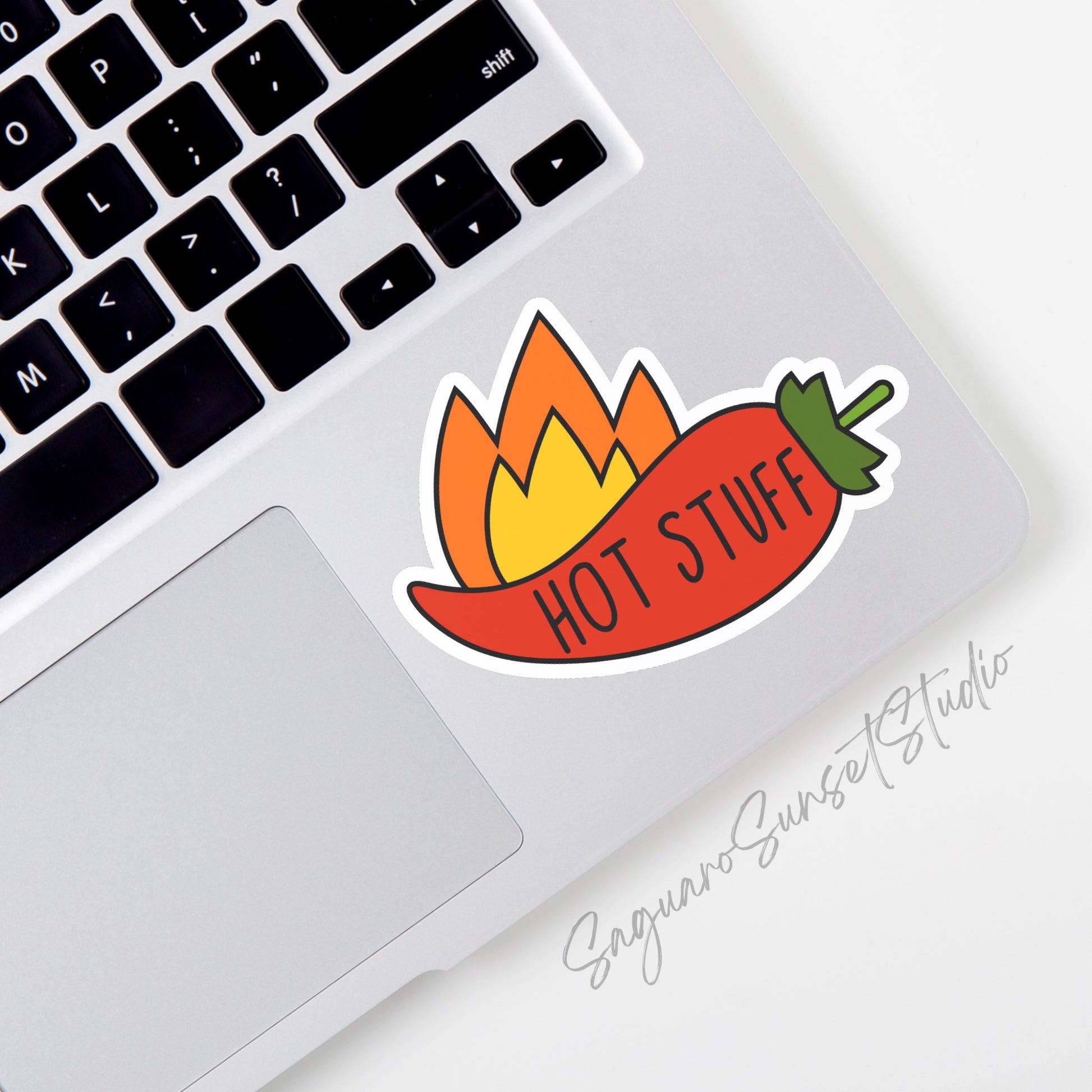 A vinyl sticker depicting a red chili pepper with yellow flames and the text "Hot Stuff"