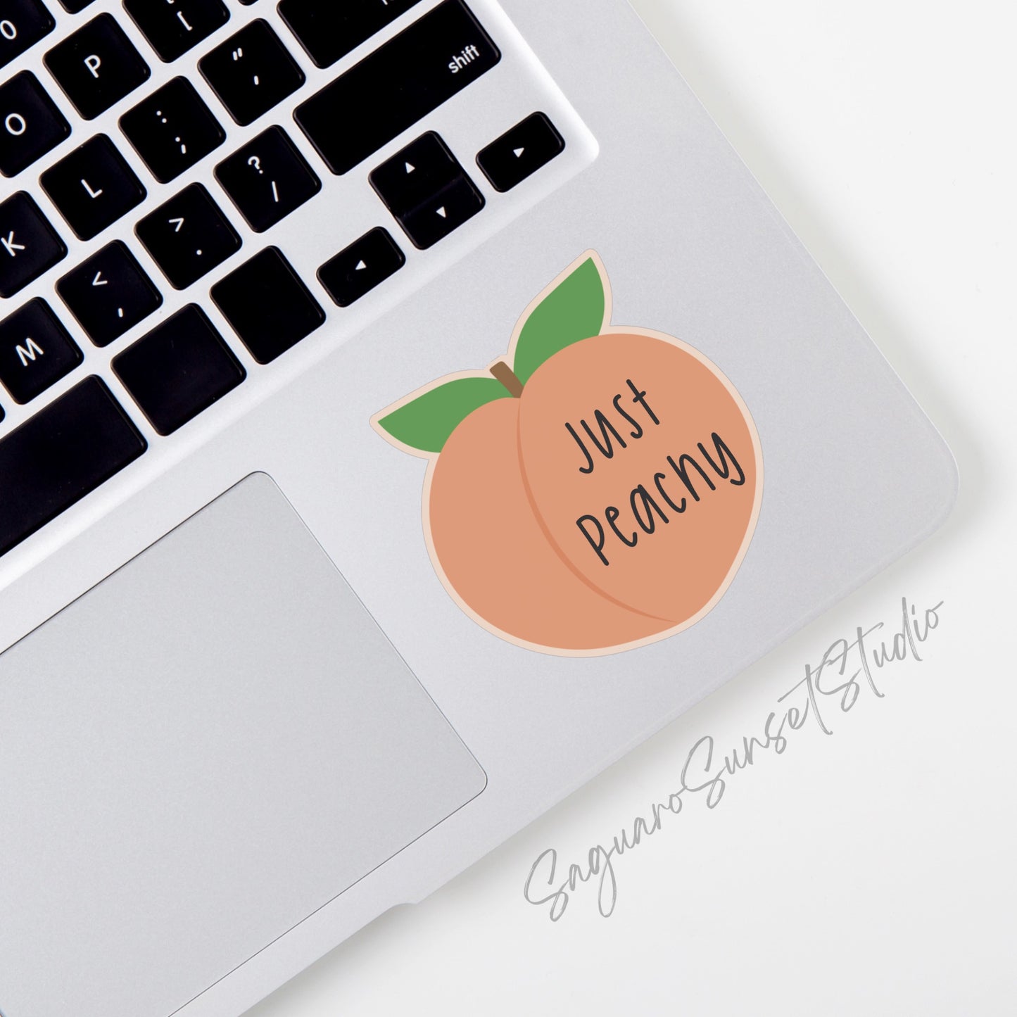 Sticker featuring a cute peach with the text "Just Peachy."