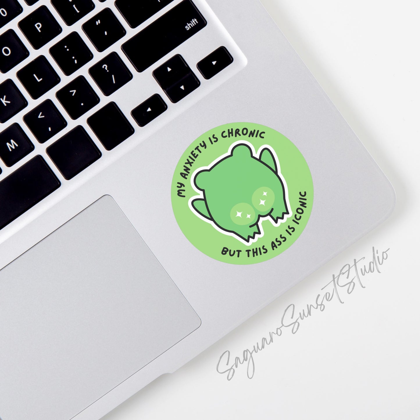 Sticker featuring the text "My Anxiety is Chronic But This Ass is Iconic" with a cute frog and sparkling cheeks.