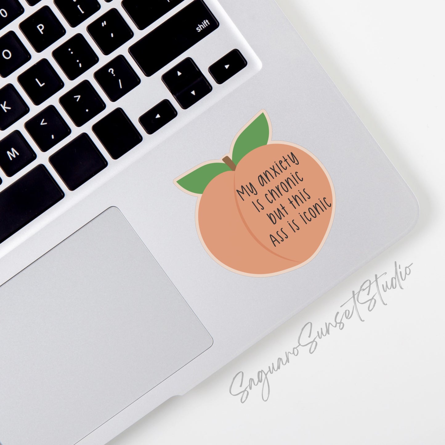 Peach-shaped sticker with the phrase "My anxiety is chronic but this ass is iconic" in bold black text