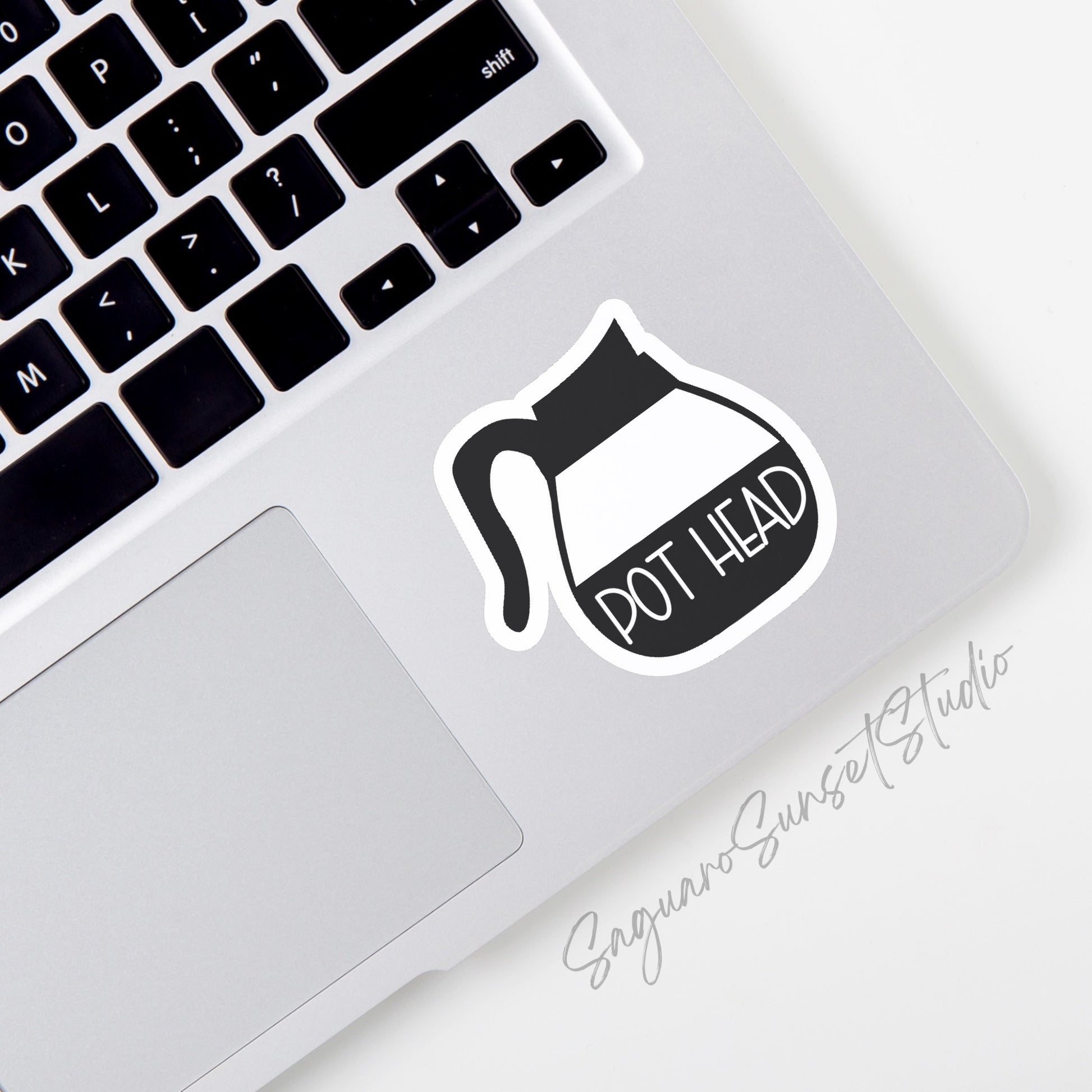 Sticker featuring a coffee pot with the phrase "Pot Head," designed for coffee lovers to add a fun and quirky touch to personal items.