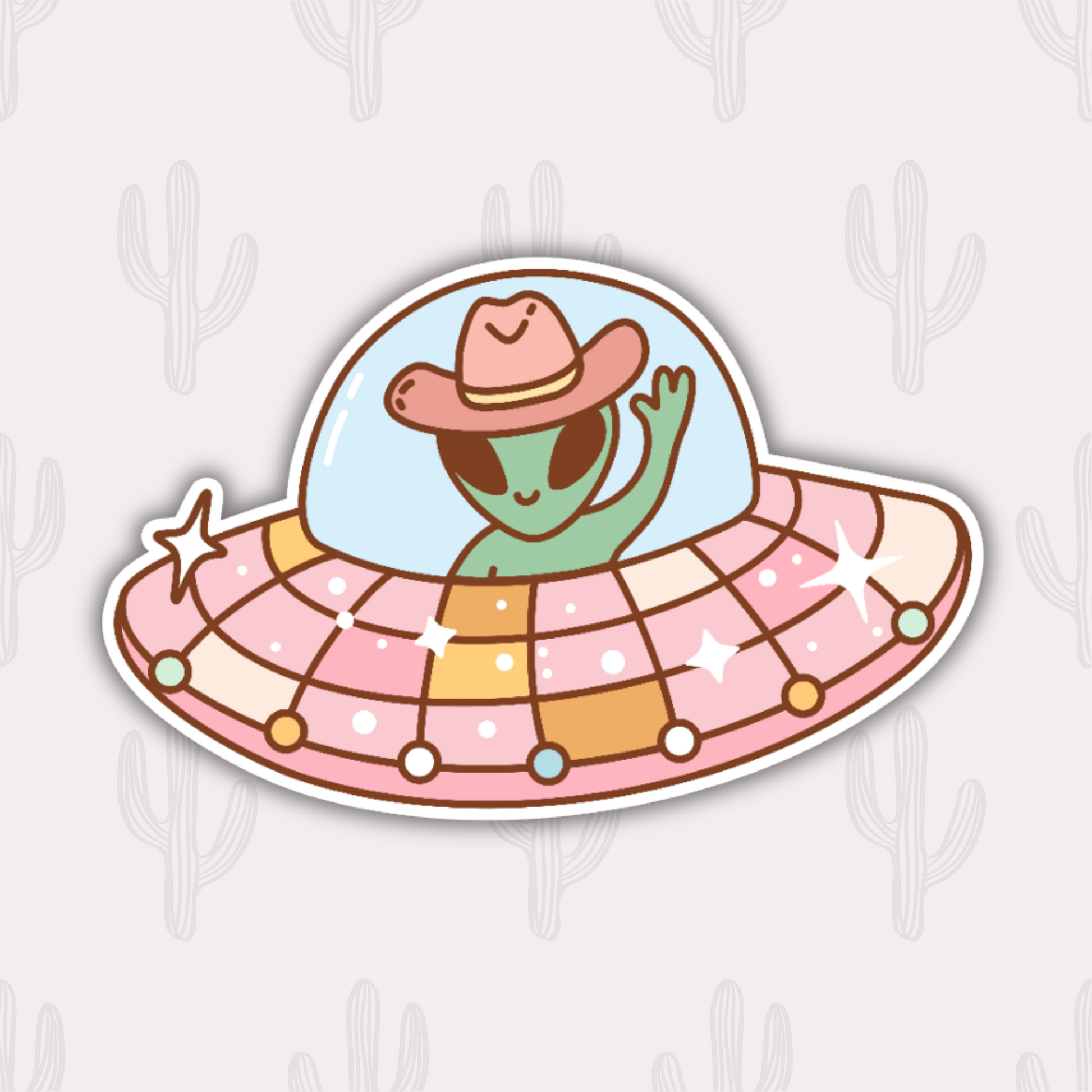 A sticker featuring a cute green alien wearing a cowboy hat, waving from inside a colorful and sparkly UFO. The UFO has a dome and is decorated with pastel colors and stars. 