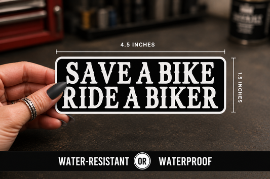 A hand holds a rectangular black sticker with white text reading “SAVE A BIKE RIDE A BIKER.” The image includes dimension labels showing 4.5 inches wide by 1.5 inches tall