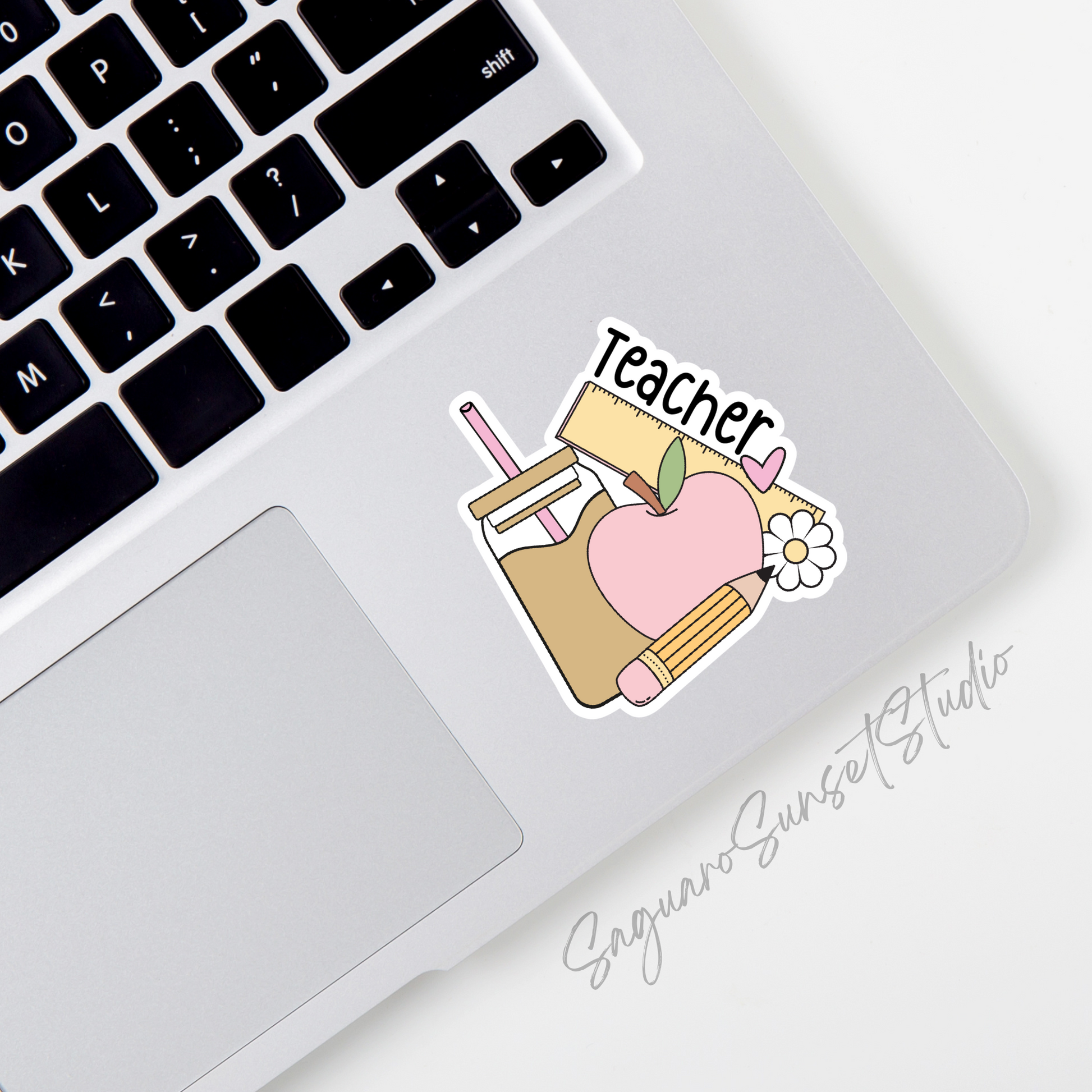 A sticker featuring a pastel-colored coffee cup, apple, ruler, pencil, and a heart with the word "Teacher" in bold black text, perfect for celebrating educators.