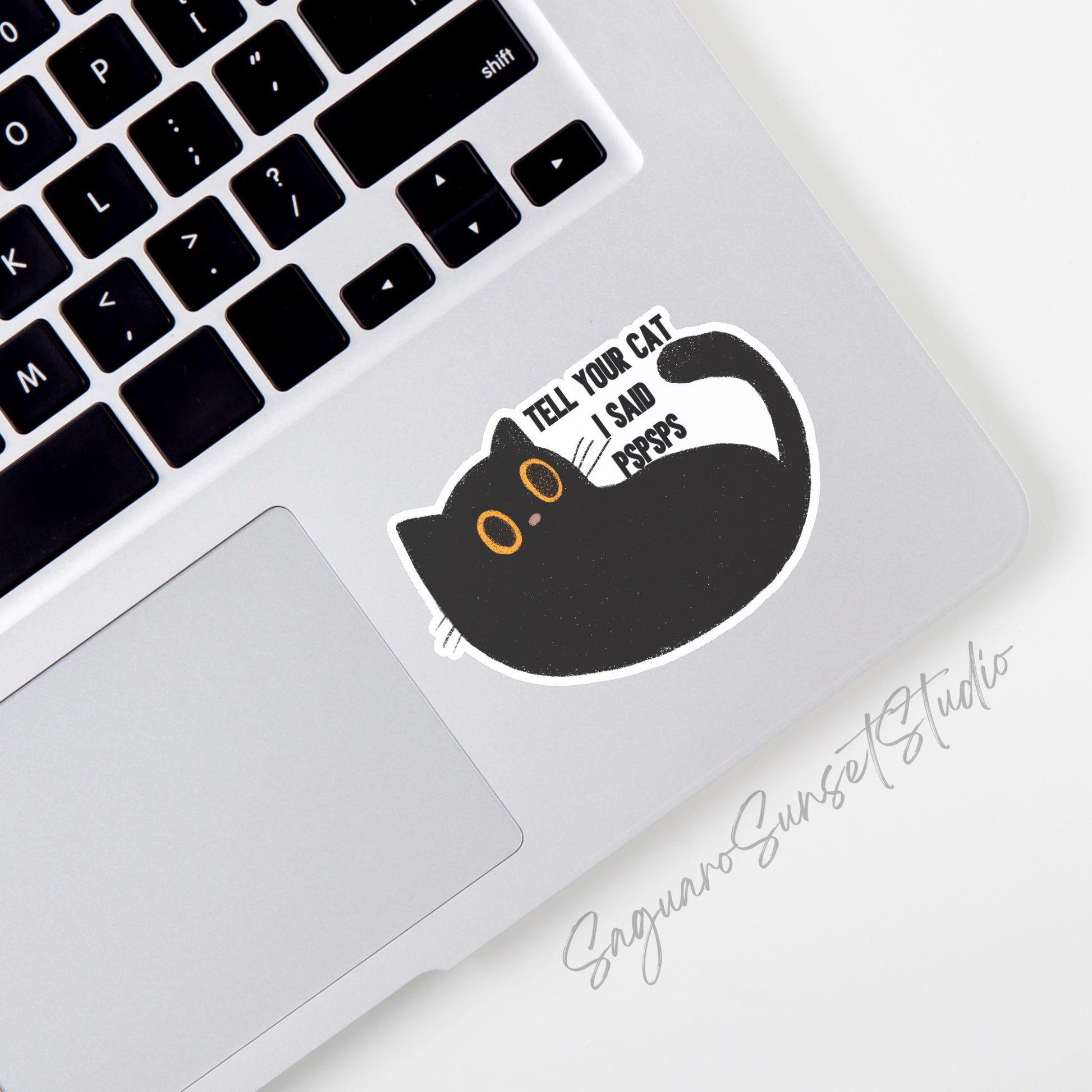 Sticker with a cute black cat with yellow eyes and the phrase "Tell Your Cat I Said PSPSPS"