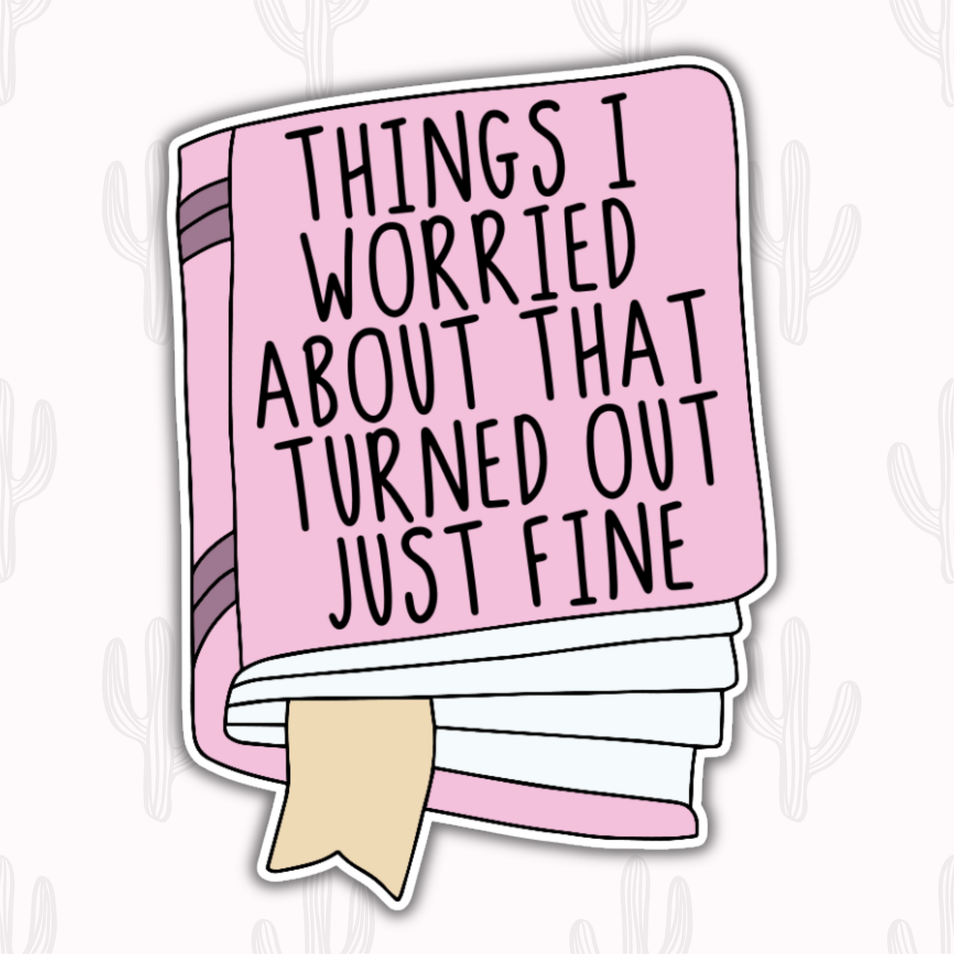A sticker featuring a pink book with the text "Things I Worried About That Turned Out Just Fine" in bold black letters, complete with a beige bookmark sticking out.