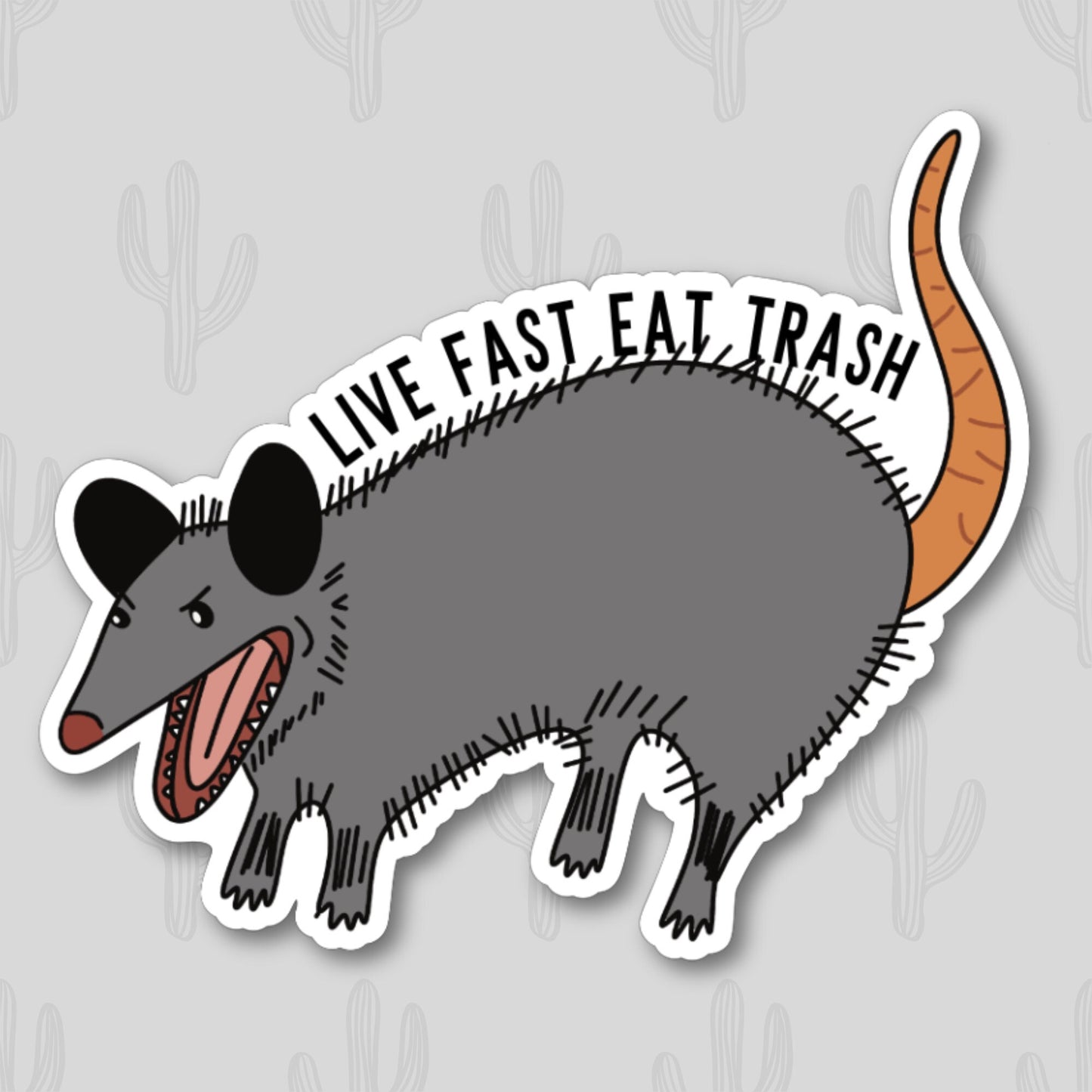 Sticker featuring an illustration of a possum with the text "Live Fast Eat Trash"