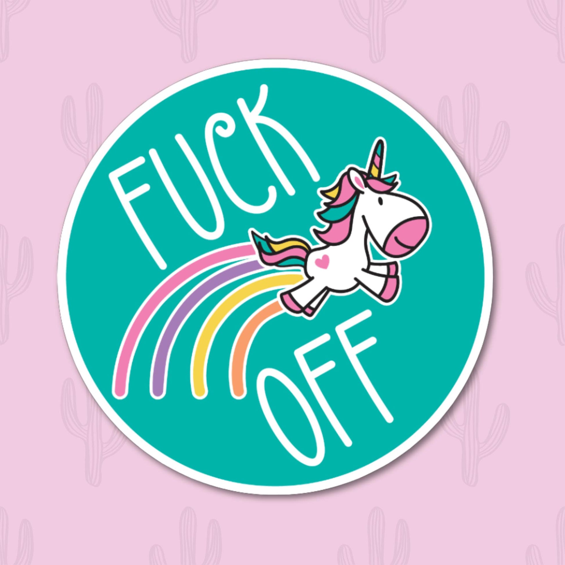 A round vinyl sticker featuring a cheerful unicorn leaving a rainbow trail, with the phrase "Fuck Off" in bold white text, set against a teal background