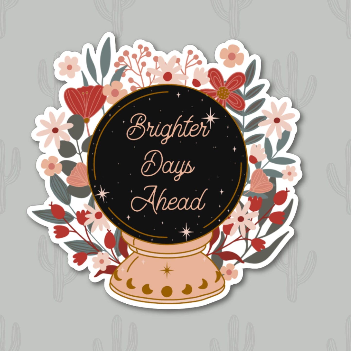 A sticker featuring a floral design surrounding a crystal ball, inside which the text 'Brighter days ahead'