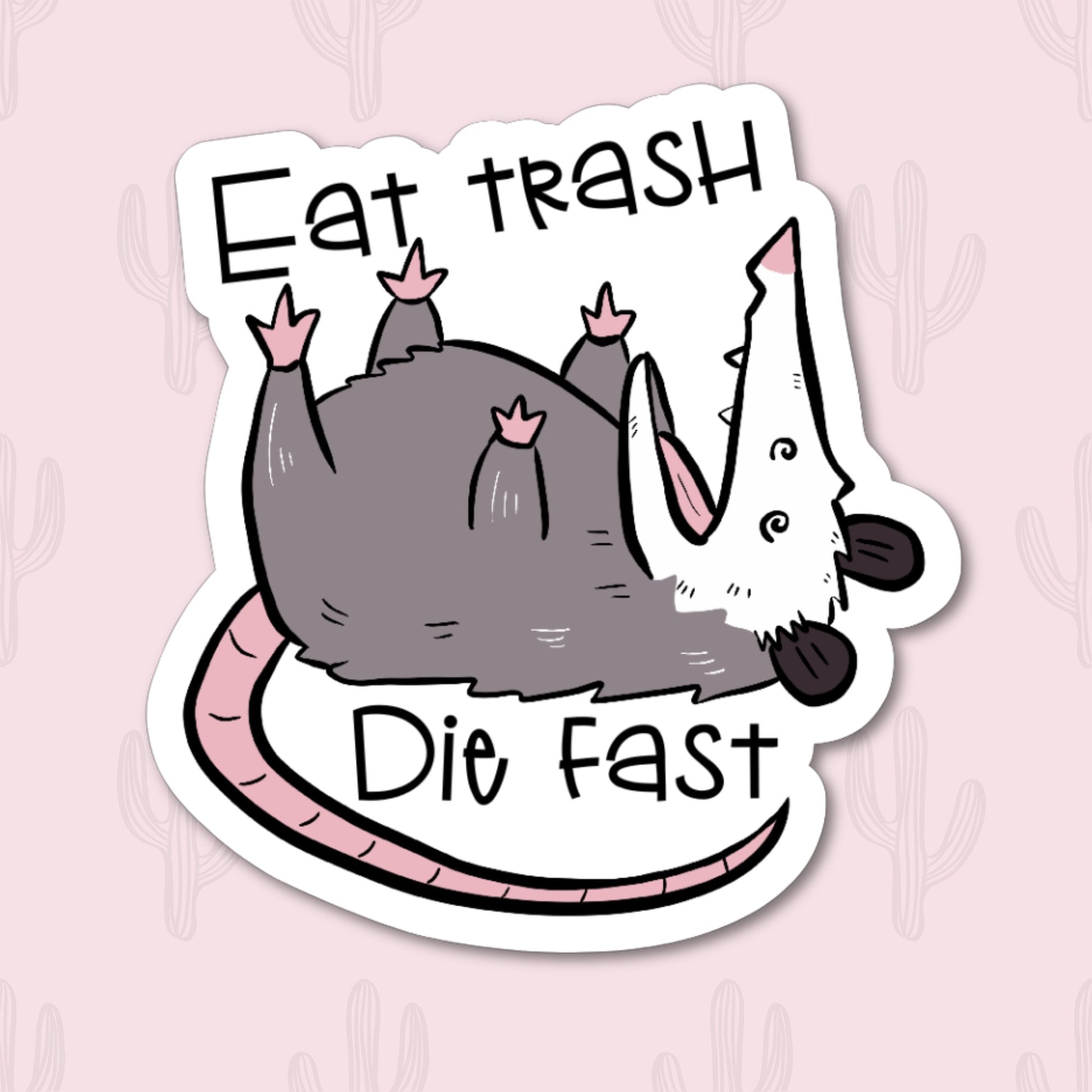 A vinyl sticker featuring the phrase "Eat Trash Die Fast" with an illustration of a possum lying on its back