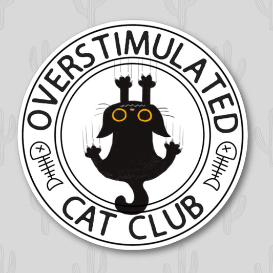 A round sticker with a black cat falling while scratching the background with the phrase 'overstimulated cat club', with fishbone accents.