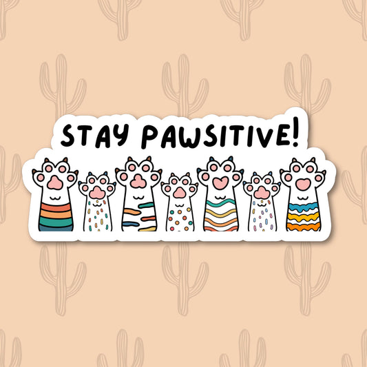 Sticker featuring a row of cheerful and colorful cat paws with the phrase "Stay Pawsitive!" designed to spread positivity and cheer.