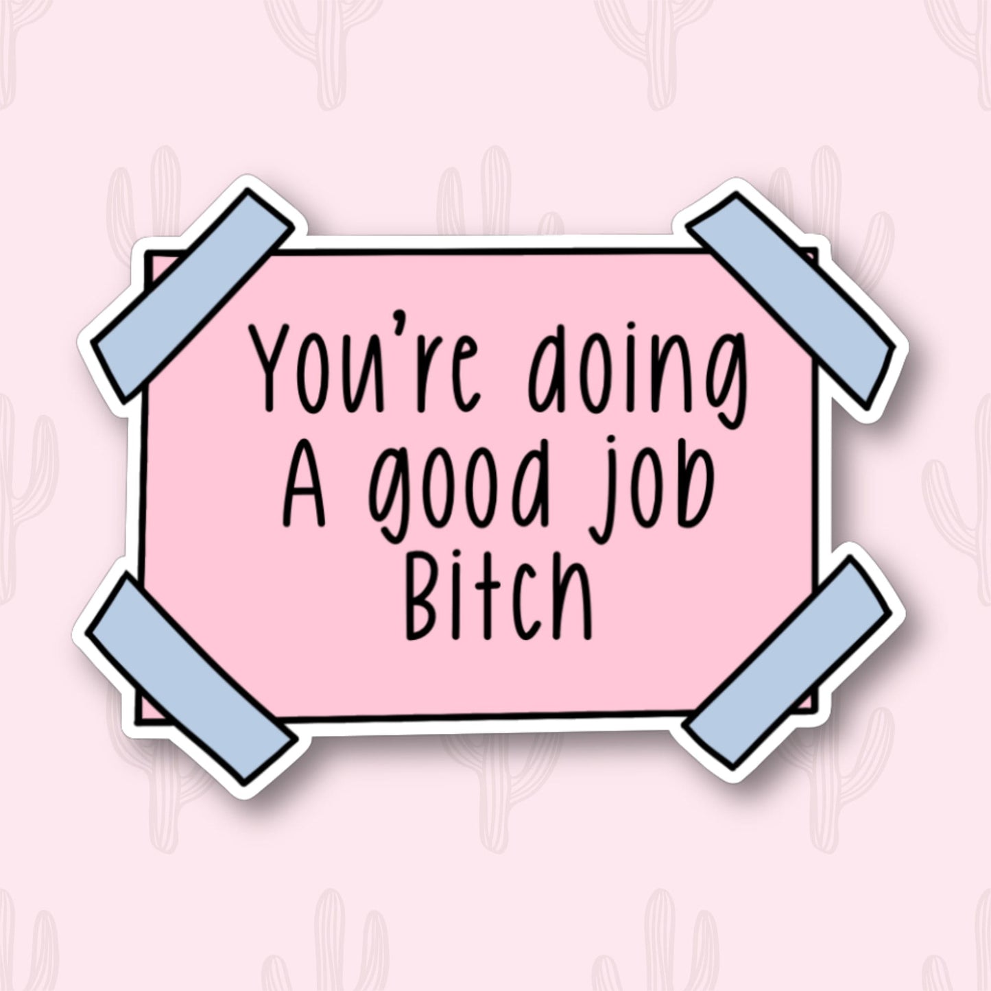 A sticker with the phrase "You're doing a good job, Bitch" written in black text on a pink rectangular background. The sticker has blue tape on each corner.