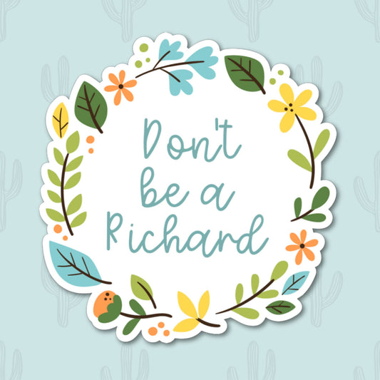 A vinyl sticker with the phrase "Don't Be a Richard" in playful lettering, surrounded by a colorful floral wreath