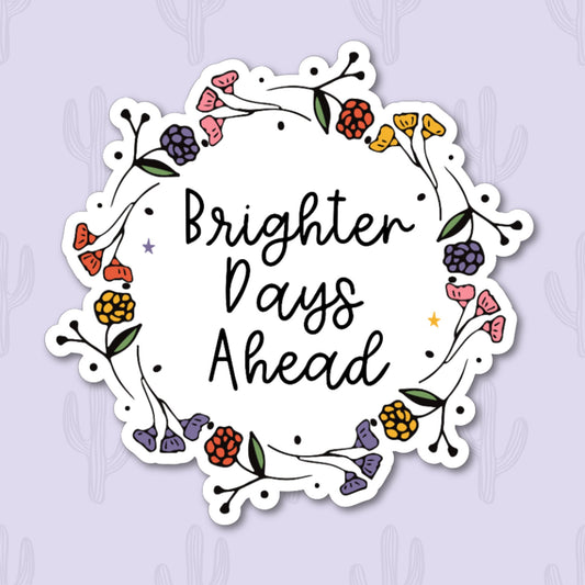 A motivational sticker with the phrase "Brighter days ahead" in cursive, surrounded by a floral frame.