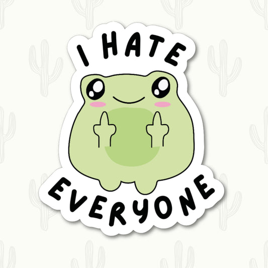 Cute green frog with a cheeky expression holding up two middle fingers and the bold text "I HATE EVERYONE" in a fun, playful font.